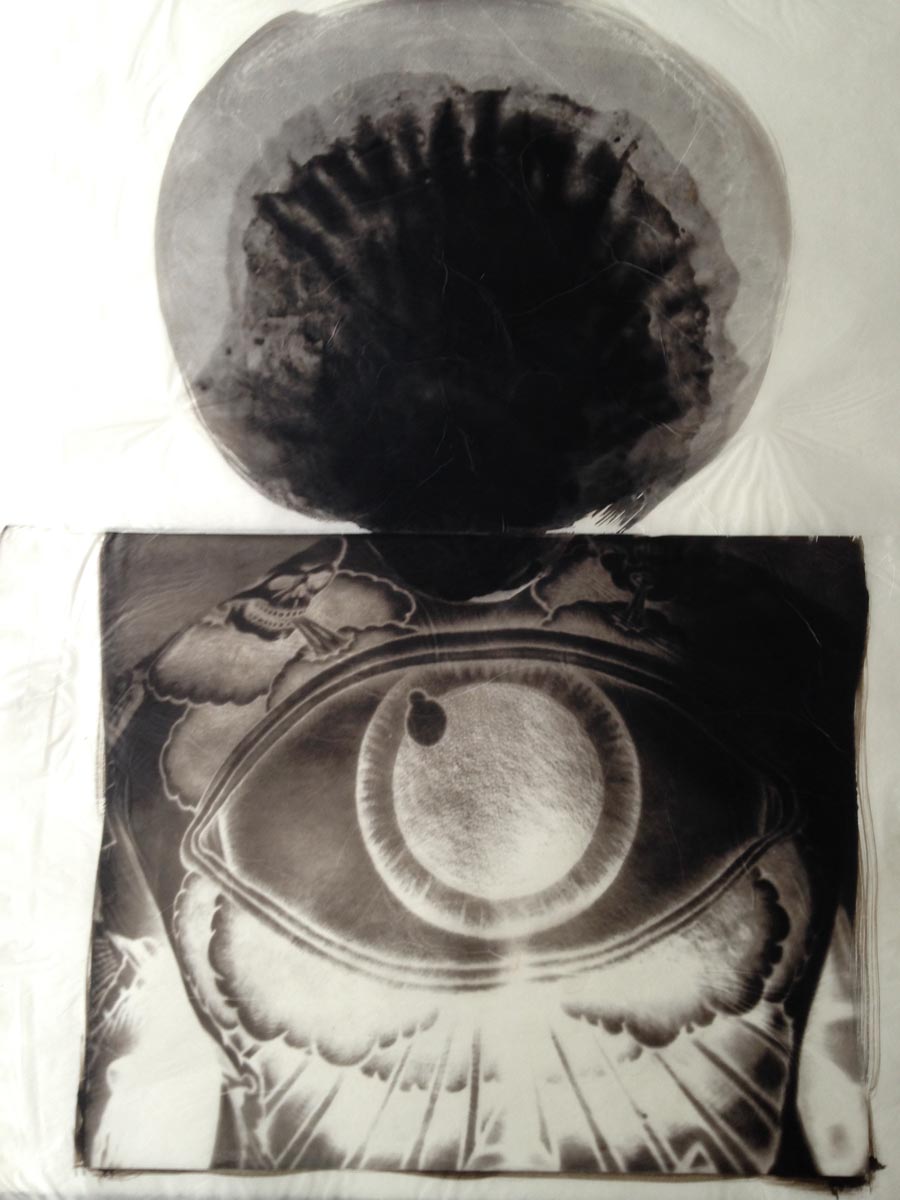 palladium print - abstract image of a eye tattoo on a man's back by Alice Garik